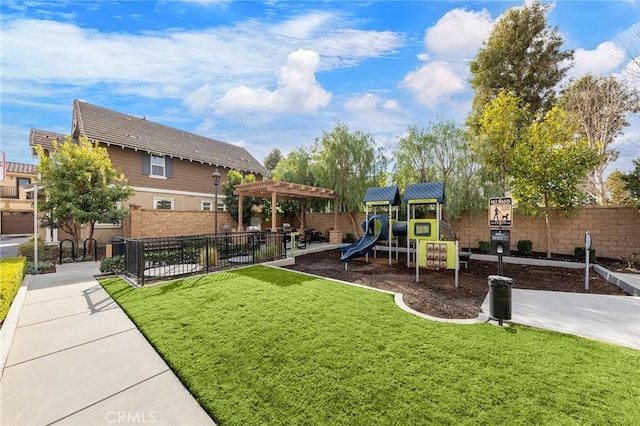 view of playground with a lawn