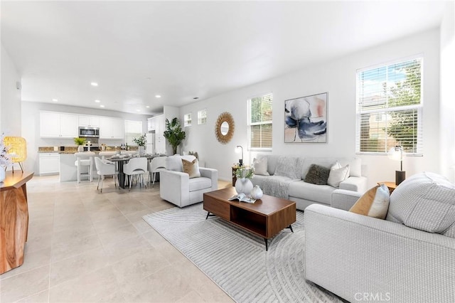 tiled living room featuring plenty of natural light