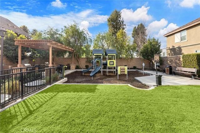 view of playground with a yard, a pergola, and a patio