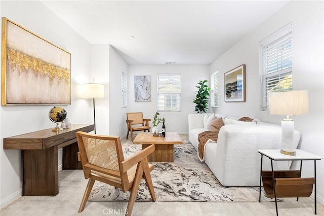 sitting room with light colored carpet