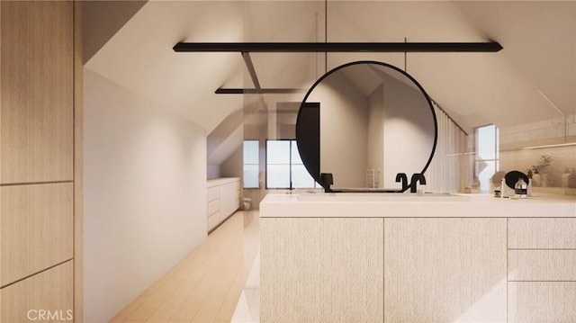 bathroom with lofted ceiling