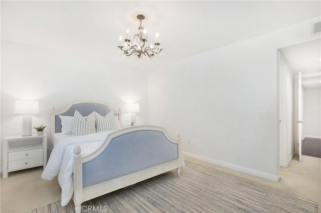 carpeted bedroom with an inviting chandelier