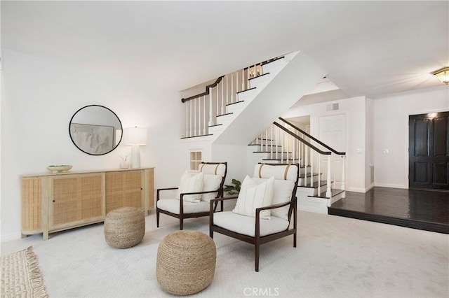 sitting room featuring carpet flooring