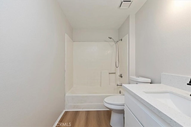 full bathroom featuring shower / tub combination, wood-type flooring, vanity, and toilet