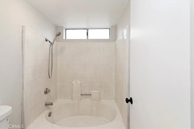 bathroom with toilet and bathtub / shower combination