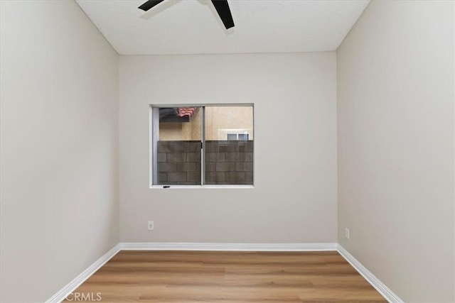 unfurnished room featuring ceiling fan and wood-type flooring