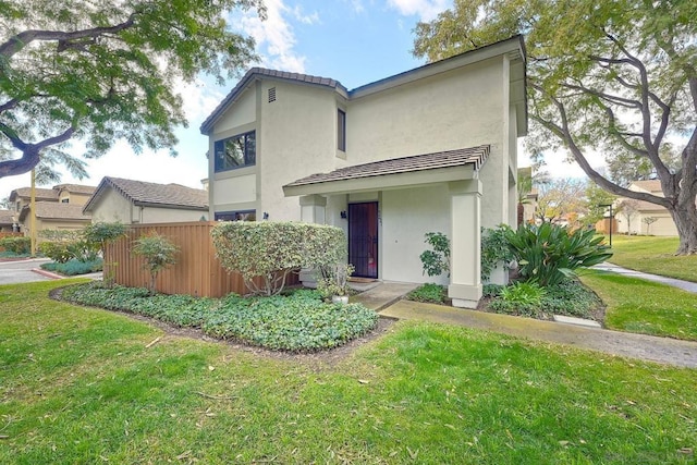 view of front of home with a front lawn