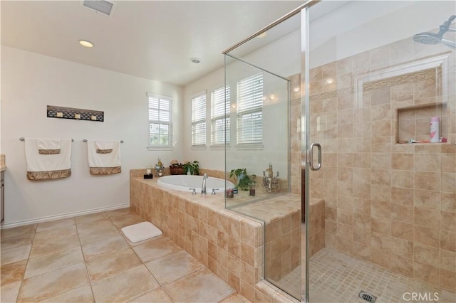 bathroom with tile patterned flooring, plus walk in shower, and vanity