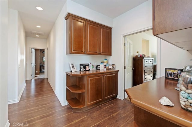 hall featuring dark wood-type flooring