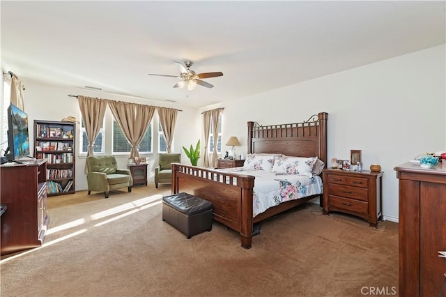 bedroom featuring dark carpet and ceiling fan