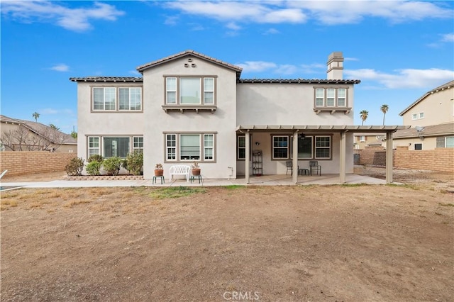 back of property with a patio