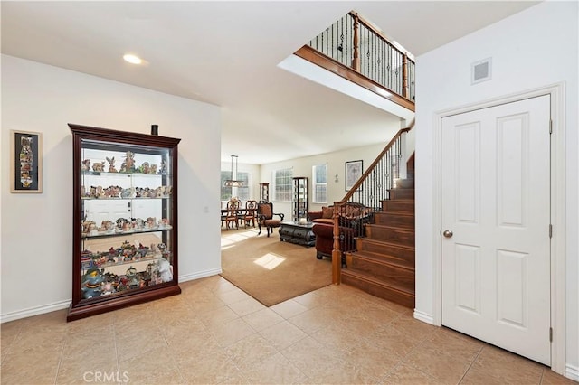 entrance foyer featuring light tile patterned flooring