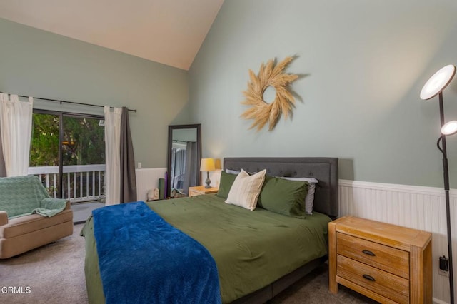 carpeted bedroom with lofted ceiling