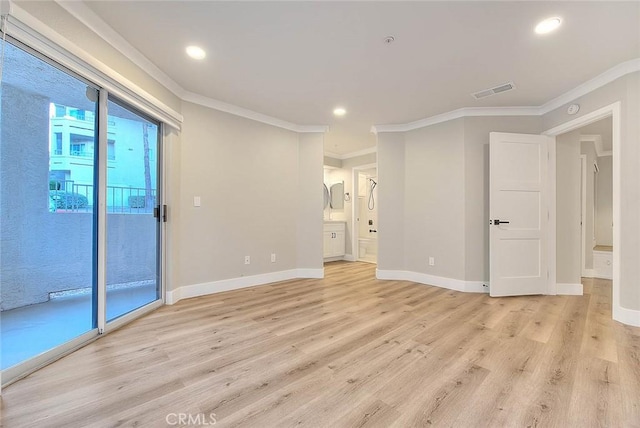 unfurnished room with crown molding and light hardwood / wood-style floors