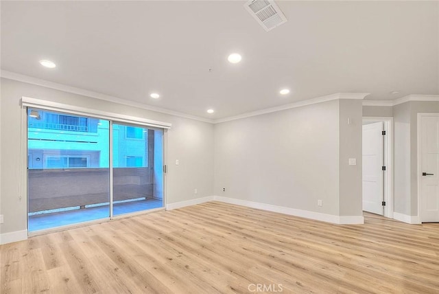 unfurnished room with crown molding and light hardwood / wood-style flooring