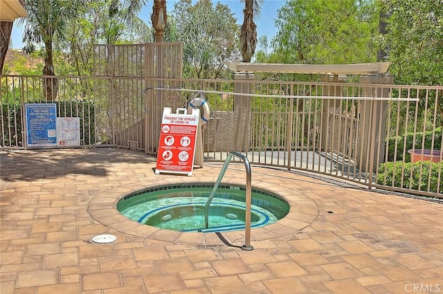 view of pool featuring a community hot tub