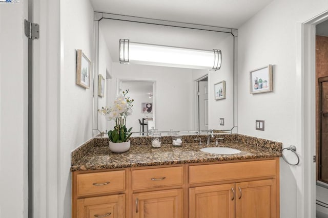 bathroom with vanity, an enclosed shower, and toilet