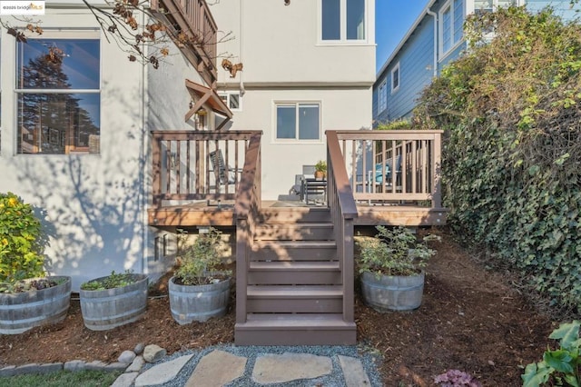 rear view of property with a wooden deck