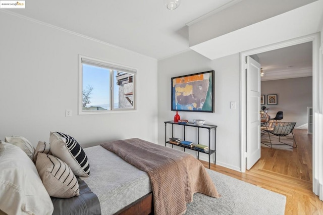 bedroom with hardwood / wood-style floors