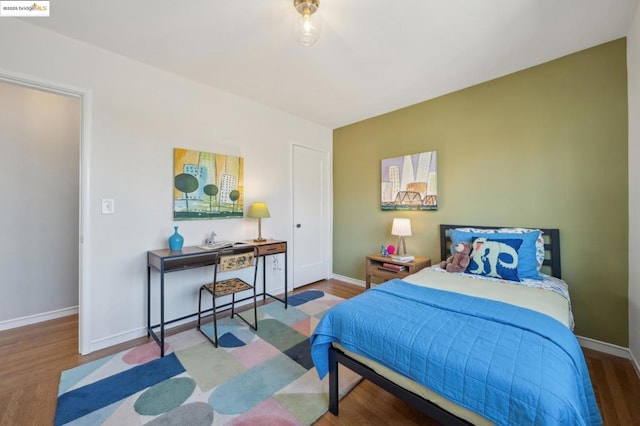 bedroom with hardwood / wood-style floors