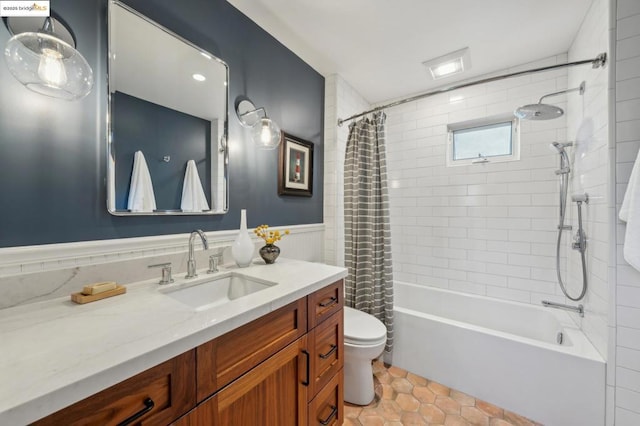 full bathroom featuring tile patterned flooring, vanity, shower / bath combo, and toilet