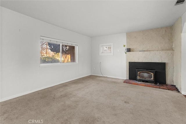 unfurnished living room featuring carpet floors