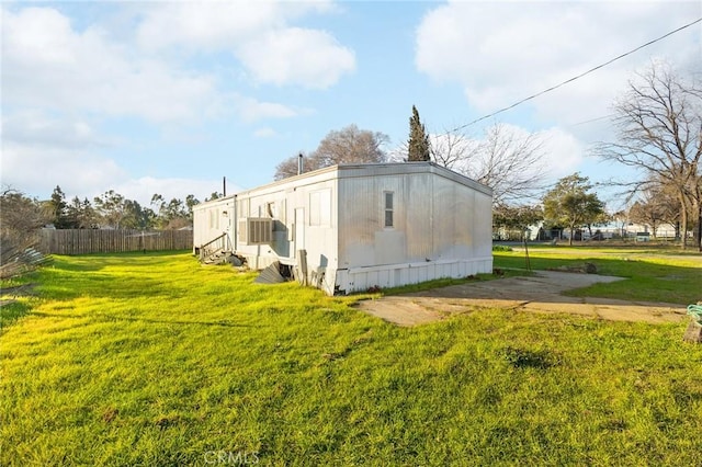 view of side of property featuring a yard