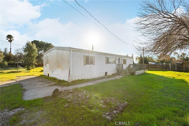 view of property exterior with a yard