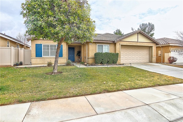 view of front of property with a garage and a front yard