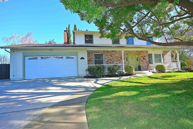 view of front of home featuring a porch, a garage, and a front yard