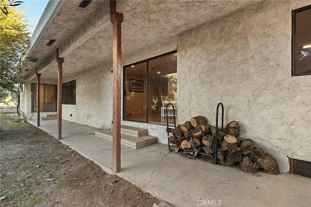 doorway to property featuring a patio area