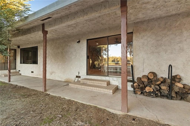 doorway to property featuring a patio