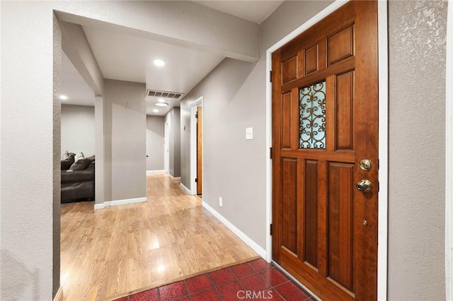 foyer entrance with hardwood / wood-style floors