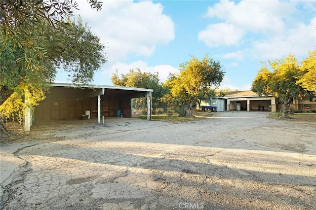 exterior space with a carport