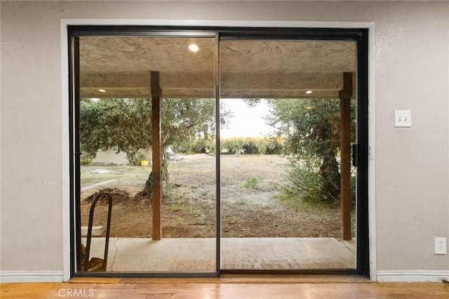 doorway to outside with hardwood / wood-style flooring