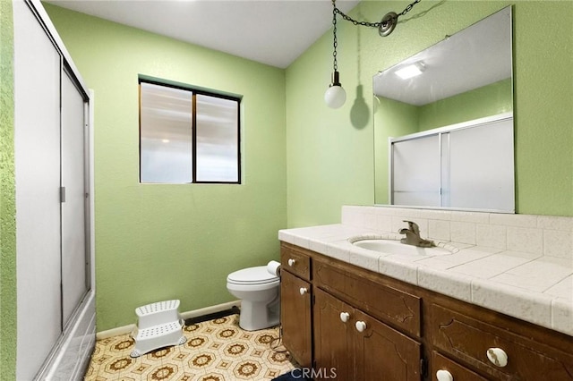 full bathroom with toilet, tile patterned floors, vanity, and shower / bath combination with glass door