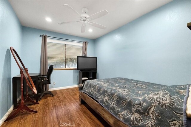 bedroom featuring hardwood / wood-style floors and ceiling fan