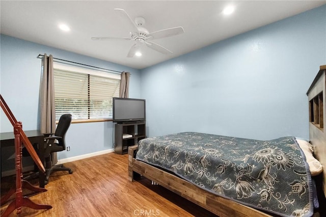 bedroom with ceiling fan and light wood-type flooring