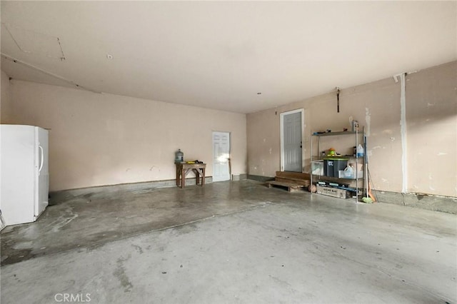 garage featuring white refrigerator