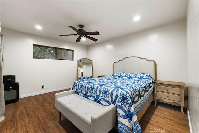 bedroom featuring ceiling fan and dark hardwood / wood-style floors