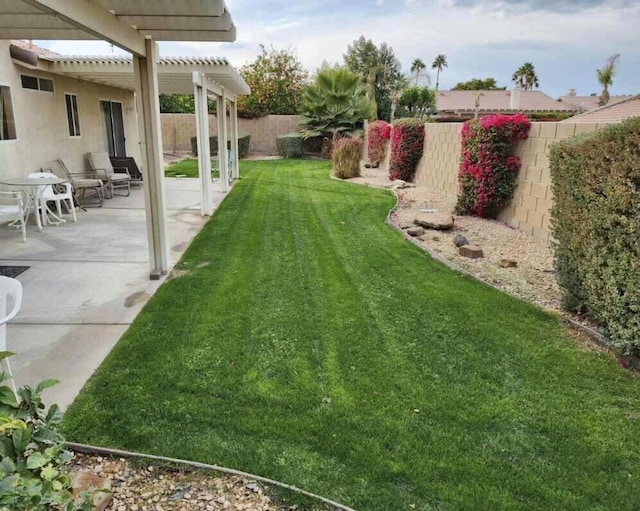 view of yard with a pergola and a patio