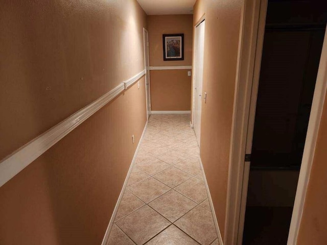 hallway featuring light tile patterned floors