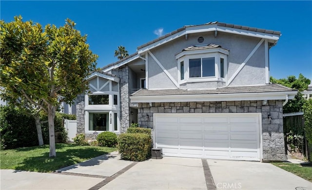 view of front of property with a garage and a front yard