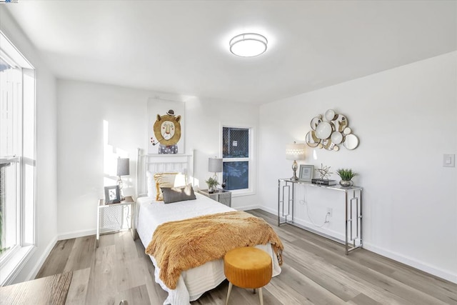 bedroom with light hardwood / wood-style floors