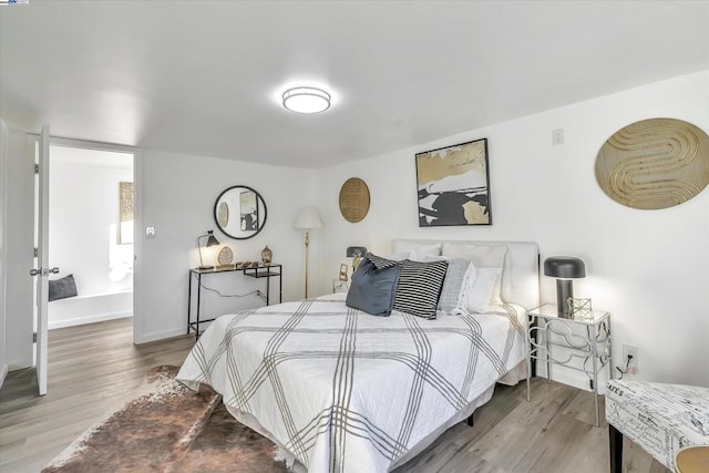 bedroom with wood-type flooring