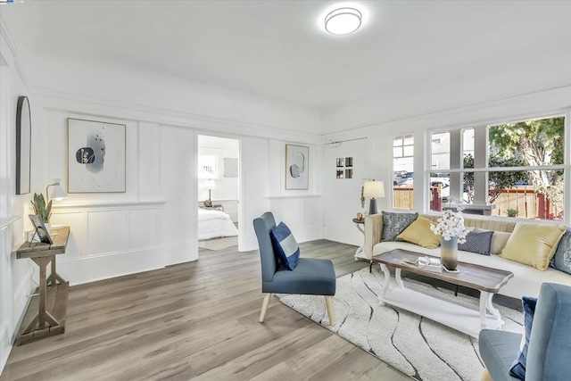 living room with hardwood / wood-style flooring and a healthy amount of sunlight