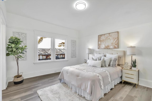 bedroom with wood-type flooring