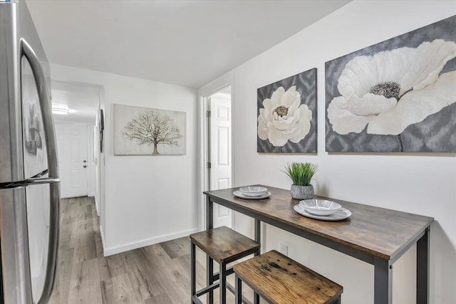 dining space featuring light hardwood / wood-style floors