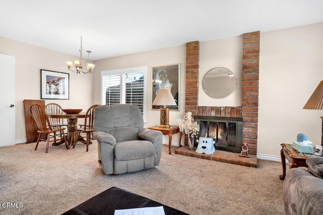 carpeted living room featuring a brick fireplace and a chandelier