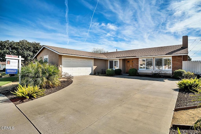 ranch-style home with a garage